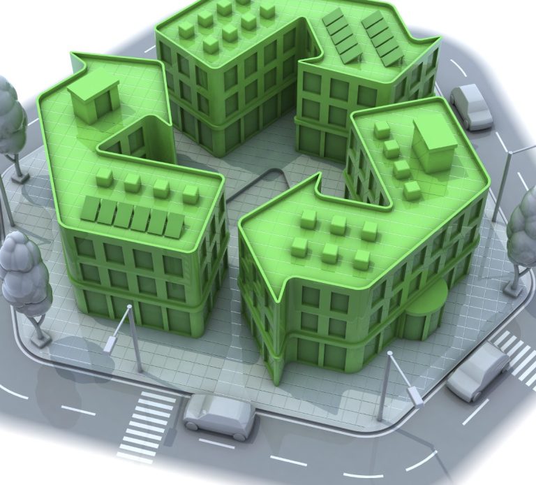 Fünfgrüne, moderne Gebäude in einer geschlossenen Anordnung mit Straßen und Bäumen.